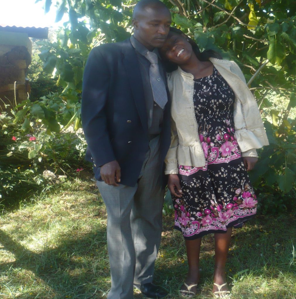 Bryson and Naomy standing together in a garden